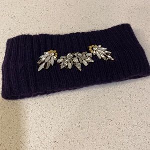 Dark purple winter headband with embellishments. Never been worn!